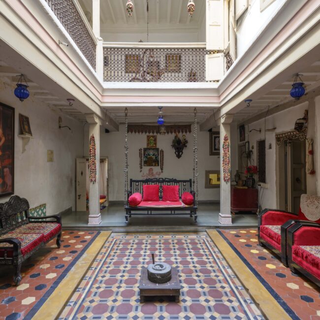 2. Chowk or courtyard of Jagdip Mehta's Heritage House with the traditional features of open skylight and swing bed-min