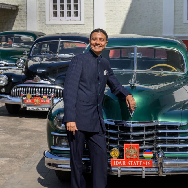 54. Karni Singh with his cars-min